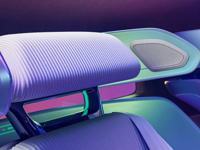 cut-off-headrest-with-knit-in-purple-mint-green-and-metal-details-with-integrated-speakers-side-view