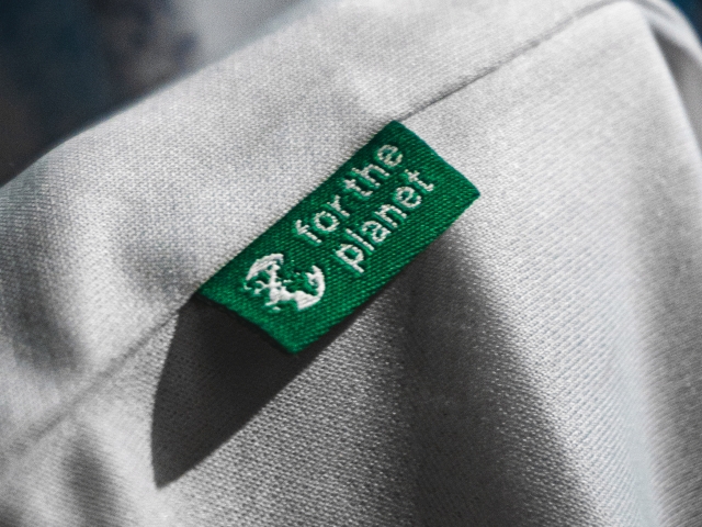 close-up-of-material-tag-in-green-with-the-inscription-for-the-planet