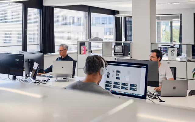 three-man-working-at-bright-white-office
