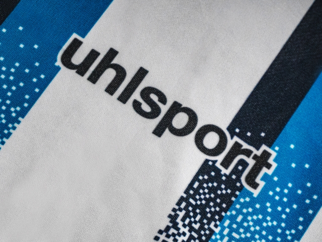 close-up-of-uhlsport-logo-in-dark-blue-on-jersey-of-stuttgarter-kickers-designed-by-studiokurbos