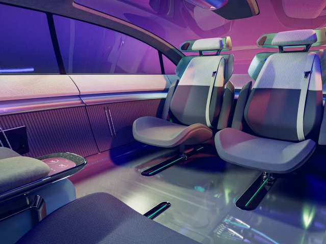 rear-seats-facing-each-other-interior-is-holistic-in-purple-with-material-mix-from-knit-to-metal-and-glossy-surfaces