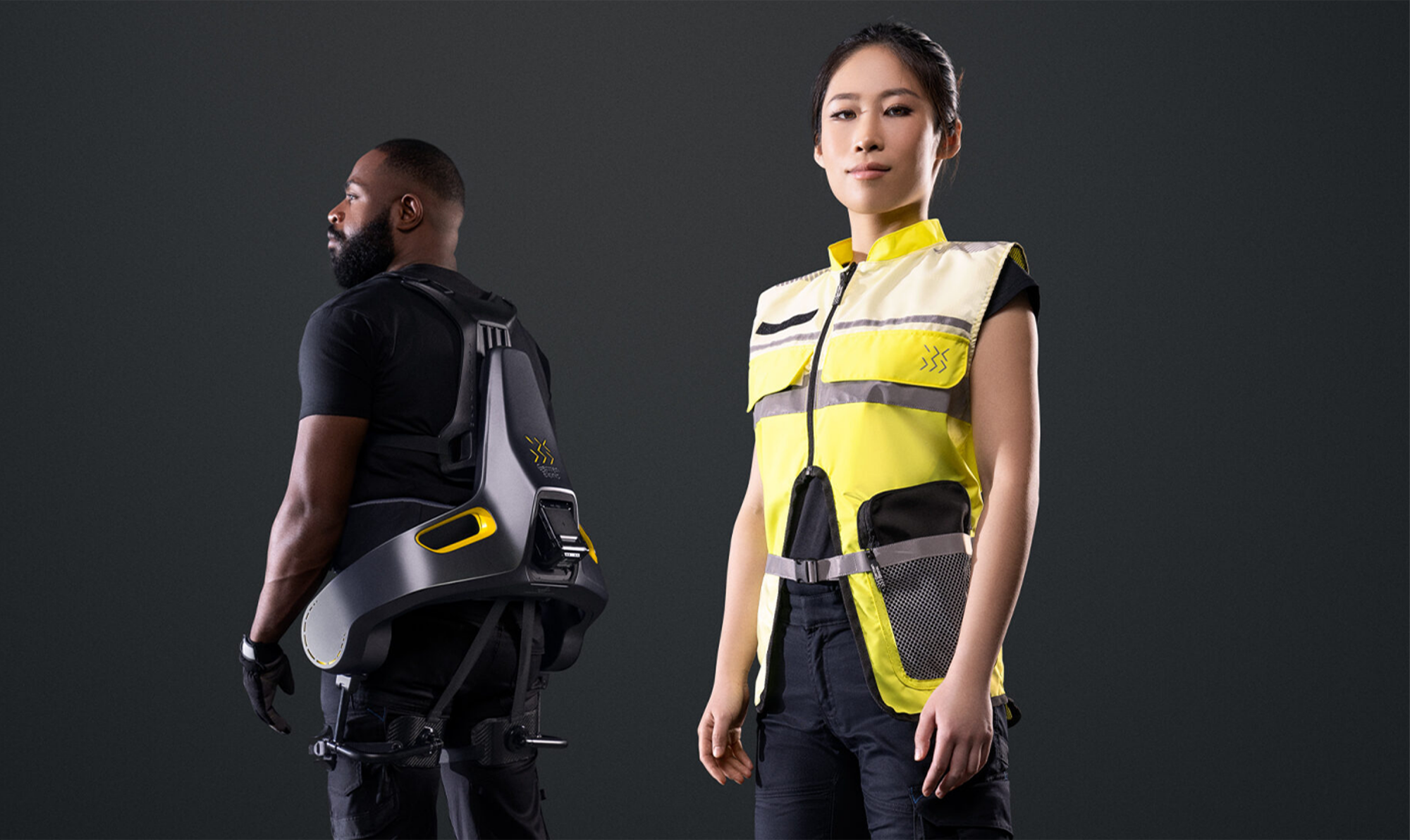 man-in-back-wears-the-apogee-exoskeleton-and-woman-in-front-wears-the-safetywest