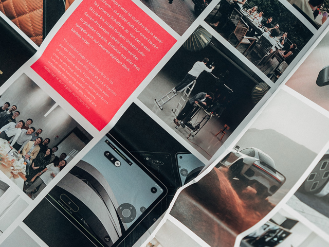 Close-up-of-the-magazine-with-a-view-of-several-images-such-as-group-photos-of-colleagues-Shanghai-cars-UI-UX-and-other-projects-by-studiokurbos