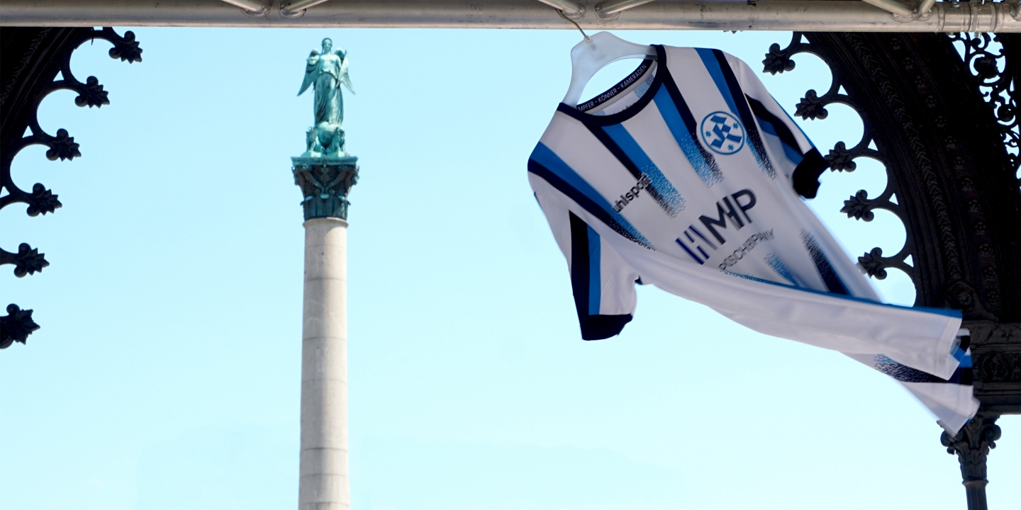 dark-blue-light-blue-striped-jersey-flying-in-the-wind-on-a-white-clothes-hanger-with-mhp-logo-jersey-design-by-studiokurbos