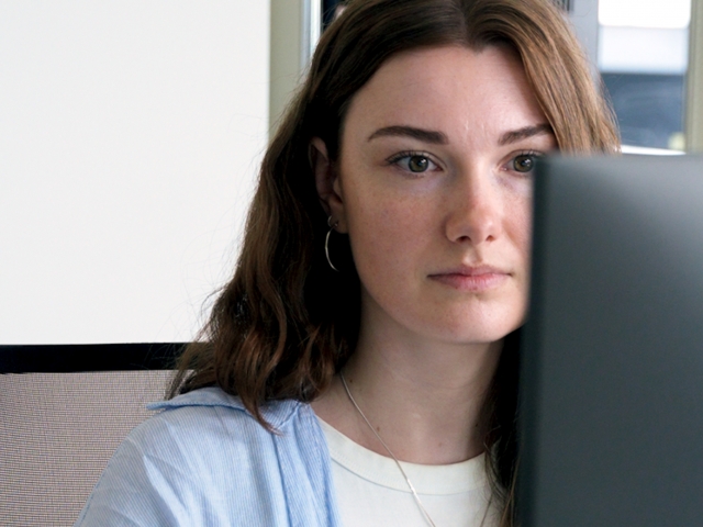 young-woman-with-brown-hair-looking-at-screen