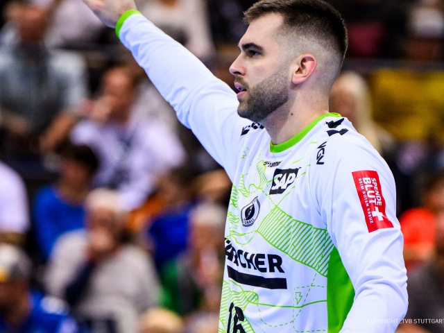 goalkeeper-from-tvb-stuttgart-lifting-hand-and-cheering-at-viewers-and-is-wearing-sustainablity-jersey-designed-by-studiokurbos