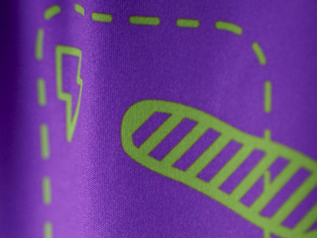 detail-shot-from-jersey-purple-background-and-green-grafical-details