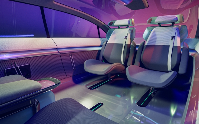 rear-seats-facing-each-other-interior-is-holistic-in-purple-with-material-mix-from-knit-to-metal-and-glossy-surfaces