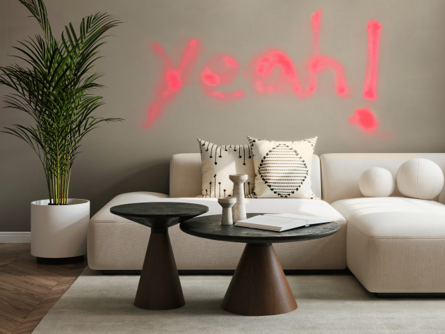 Beige-Sofa-in-between-beige-wall-with-the-sprayed-lettering-Yeah-in-Pink-should-give-a-colourmotion-for-the-safe-Simonas