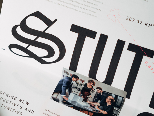 Close-up-of-magazine-with-bold-lettering-Stuttgart-and-staff-photo-with-four-people-on-it